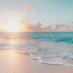 Couple on a Dominican Republic beach at sunset — Dominican Republic honeymoon planning guide